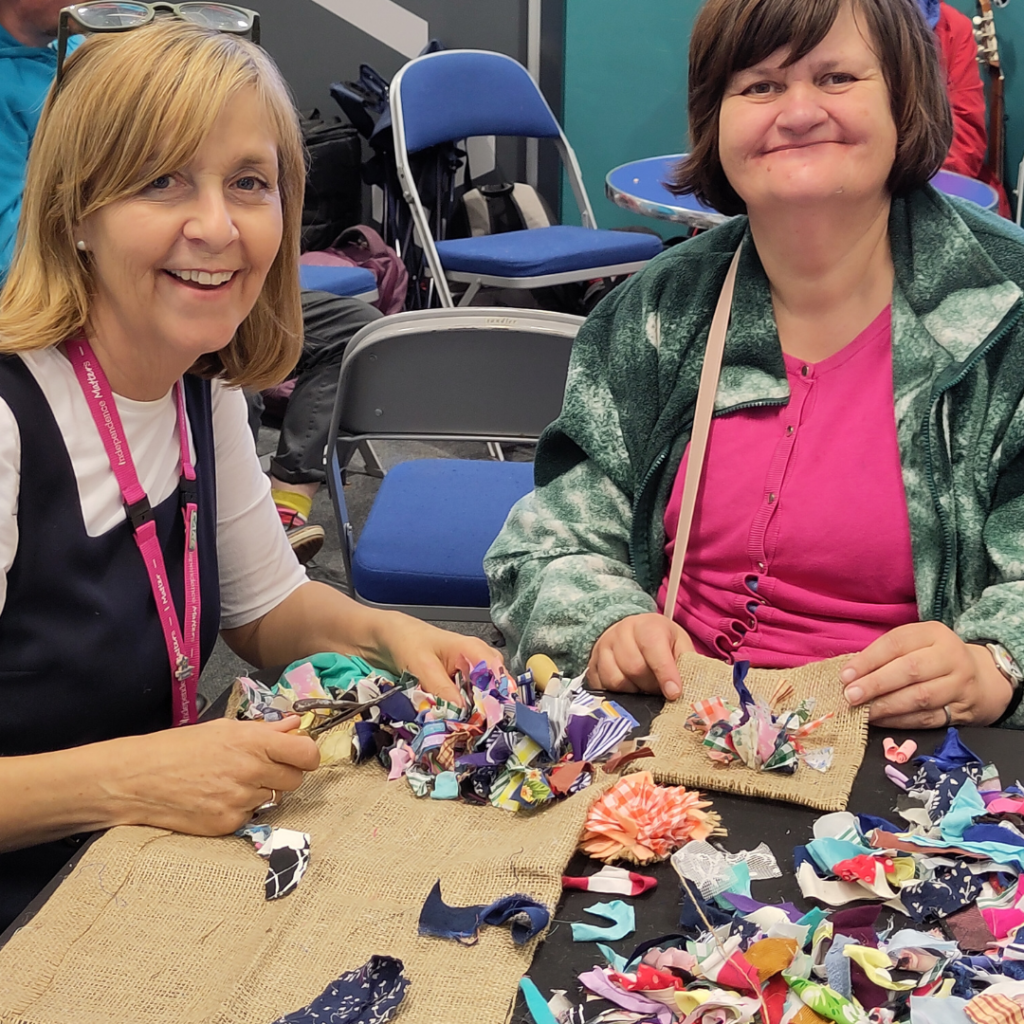 Adults rag rugging at  Volunteer Extravaganza - June 2024